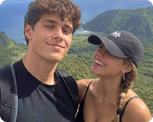 Two friends smiling together after a hike.